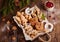 Box with variety of Christmas cookies: gingerbread deer, stars, Christmas trees, Biscotti, cantucci, horseshoes