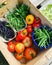 box with various vegetables harvested in the garden, fresh beans, basil, tomatoes, round peppers, home garden harvest