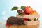 Box of vegetables and fruit, funny grey hedgehog sitting on wooden table
