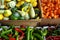 Boxed Peppers and Gourds for Sale at a Farmers Market