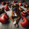 Boxer dog reclining, with associated boxing gloves around him
