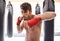 Boxer, gym and portrait for fitness, wellness and exercise in strong training for confidence to fight. Man, sport and