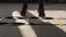 Boxer jumping on divided sections on floor. Close-up of sneakers