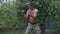 Boxer man training box outdoor. Kickboxer training fist punch at outdoor workout. Male fighter