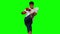 Boxer performing a high kick on green screen