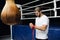 Boxer prepare for a fight. Young boxer in white t-shirt