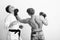 Boxer punching young karate athlete