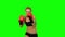 Boxer standing in the front and sends butted an opponent standing on the spot. Green screen. Close up