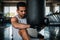 Boxer training on a punching bag in the gym