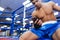 Boxer using smartphone in gym