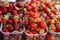 Boxes with fresh strawberries on the market - image
