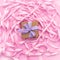 Boxes with gifts on the background of a Coil of decorative satin ribbons of pink color.