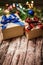 Boxes with gifts on the background of FIR branches, cones and garlands