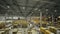 Boxes with goods on high racks in warehouse on manufacturing plant drone view