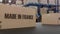 Boxes with MADE IN FRANCE text on conveyor. FRANCE goods related loopable 3D animation