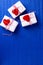 Boxes with presents with hearts  on   bright  blue textured  paper background.