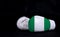 Boxing glove with Nigeria flag on black background