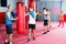 Boxing instructor and young children practicing blows