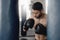 Boxing man, punching bag and strong power, focus mma and fighter training challenge in gym club, exercise and combat