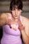 Boxing, punch and portrait of woman with fitness, power and fearless training challenge in gym. Strong body, muscle and