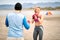 Boxing sparring boxers at beach exercise. Man and woman  sparring  together