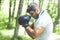 Boxing training endurance. Man athlete concentrated face with sport gloves practicing boxing nature background. Boxer ready to