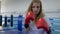 Boxing training, sportswoman works out boxer strikes at camera on ring