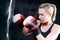 Boxing training woman with punching bag in gym