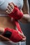 Boxing woman binds the bandage on his hand, before training, detail photo