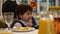 Boy 3-4 years to eat French fries and drink juice