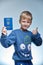 BOY 7 YEARS KEEP IN THE HANDS OF A CHILDREN`S PASSPORT OF UKRAINE FOR TRAVEL