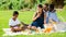 Boy addicting in phone on family picnic