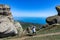 A boy against the background of ancient limestone high mountains. The Valley of Ghosts. Demerji. Crimea.