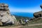 A boy against the background of ancient limestone high mountains. The Valley of Ghosts. Demerji. Crimea.