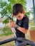 Boy applying silicon glue