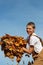 Boy Armful of Leaves