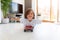 Boy with arms open lying on skateboard