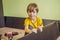 Boy assembling furniture. Boy helping his dad at home. Happy Family concept