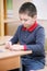 Boy assembling puzzles