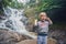 Boy in the background of beautiful cascading Datanla waterfall I