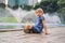 Boy on background of Fountain on the lake in the evening, near by Twin Towers with city on background. Kuala Lumpur