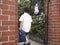 Boy With Backpack Entering School Gate