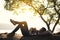 Boy backpacker sleeping on the rock in nature