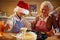 Boy baking cookies with grandmother on Christmas