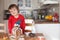 Boy, baking ginger cookies for Christmas