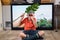 Boy in bandana imitating scouting with field-glass