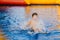 The boy bathes in the children`s pool. boy playing in the inflatable pool