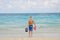 Boy on the beach playing in the sand