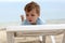 Boy on beach sunbed