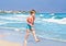 Boy on beach wearing inflatable armbands